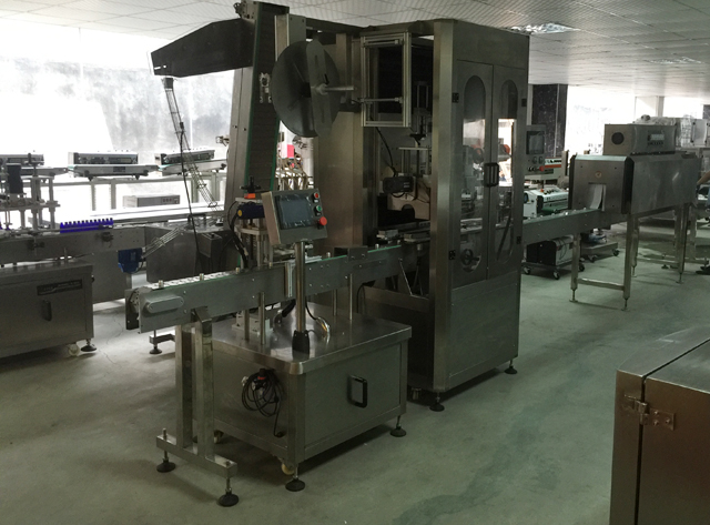 máy dán nhãn ống băng.jpg