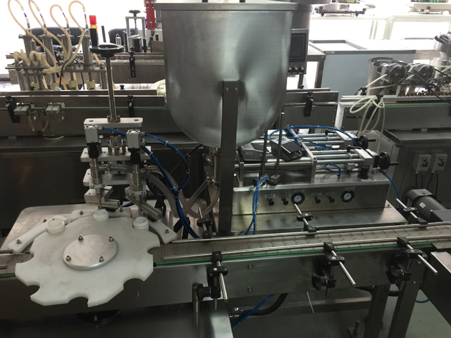 máy chiết rót hai lọ.jpg