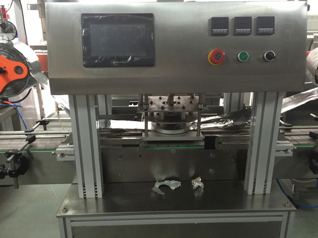 máy đóng lọ.jpg