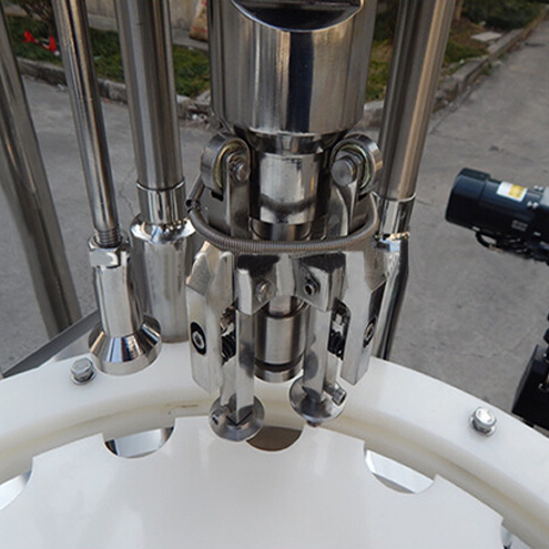 ropp capping heads for vial capper Thiết bị đóng nắp chai ROPP.jpg