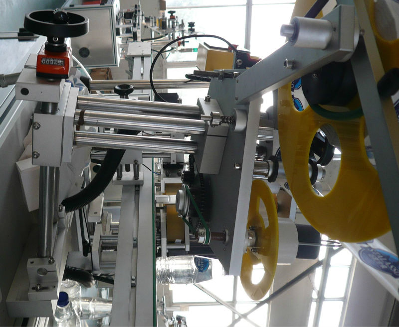 máy dán nhãn tự dính hai mặt lên xuống