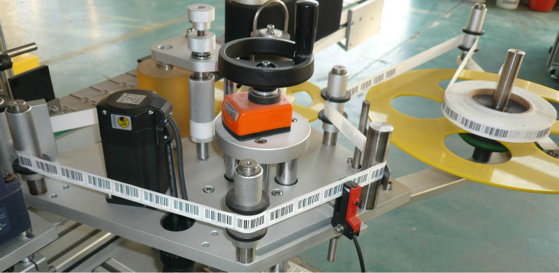 máy dán nhãn tự dính hai mặt lên xuống