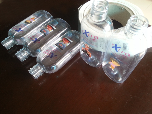 transparent labels labelled samples bottles plane surface Mẫu nhãn và chai trong suốt của Mrwan (3).jpg